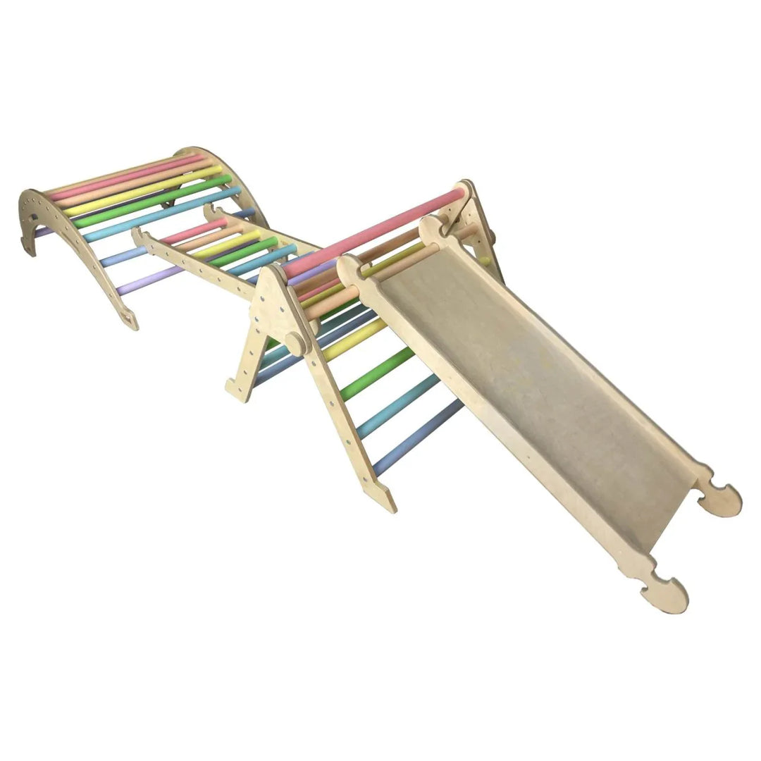 Pikler inspired climbing set in pastel rainbow colours. Triangle, and arch linked by a ladder with a slide attached to the triangle.